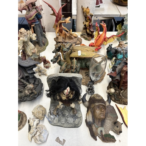 405 - A collection of resin fantasy figurines and wall plaques to include Dragontails, Land Of The Dragons... 