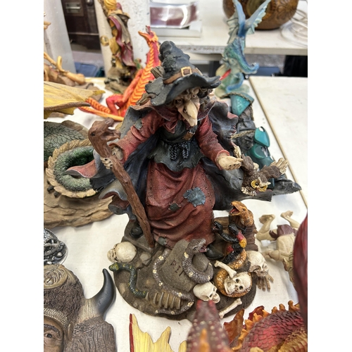 405 - A collection of resin fantasy figurines and wall plaques to include Dragontails, Land Of The Dragons... 