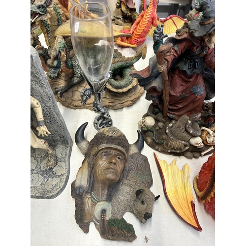 405 - A collection of resin fantasy figurines and wall plaques to include Dragontails, Land Of The Dragons... 