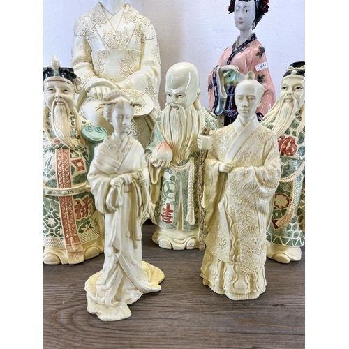 406 - Seven Past Times resin figurines - largest approx. 65cm high