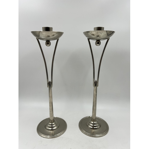 422 - A pair of Art Deco style chrome plated candle sticks - approx. 32cm high