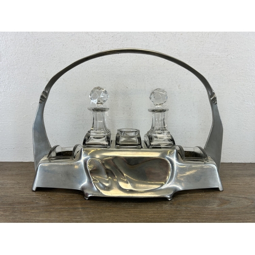 424 - An Art Nouveau Hugo Leven for Kayserzinn pewter and crystal cruet set, no. 4538 - approx. 20cm high ... 