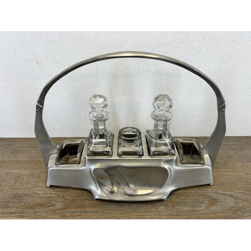 424 - An Art Nouveau Hugo Leven for Kayserzinn pewter and crystal cruet set, no. 4538 - approx. 20cm high ... 