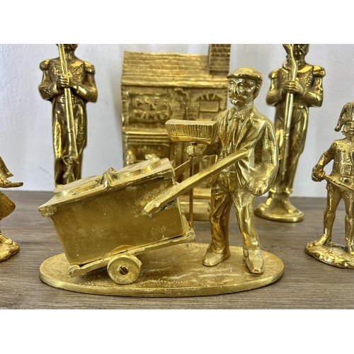 425 - Six brass figurines - largest approx. 29cm high