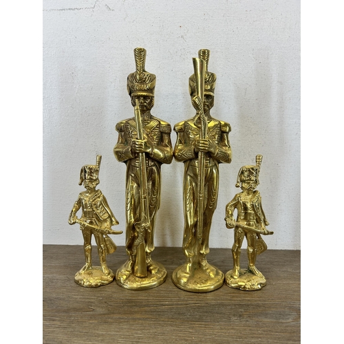 425 - Six brass figurines - largest approx. 29cm high