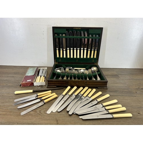 429 - A collection of mid 20th century stainless steel and EPNS cutlery