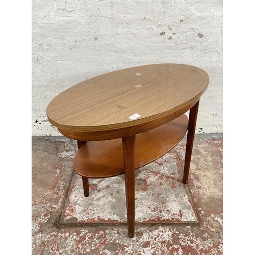 101 - A mid 20th century teak effect and beech two tier side table