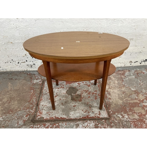101 - A mid 20th century teak effect and beech two tier side table