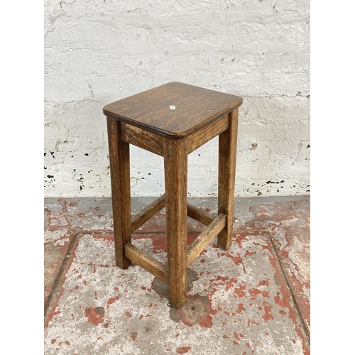 106 - A mid 20th century oak and beech lab stool - approx. 56cm high