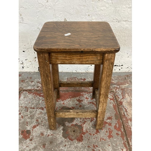 106 - A mid 20th century oak and beech lab stool - approx. 56cm high