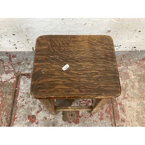 106 - A mid 20th century oak and beech lab stool - approx. 56cm high