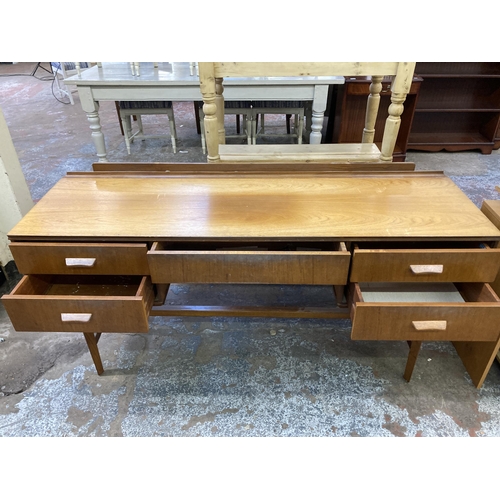112 - A mid 20th century Gimson & Slater Ltd. Vesper Furniture teak dressing table