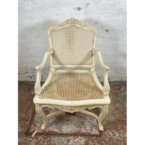 126 - A French style white painted and rattan open armchair