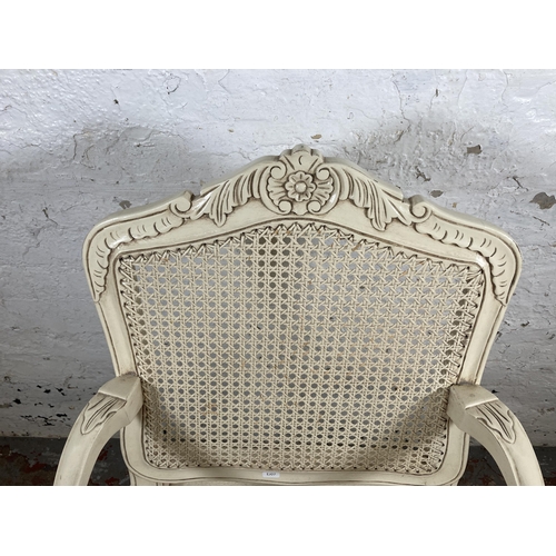 126 - A French style white painted and rattan open armchair