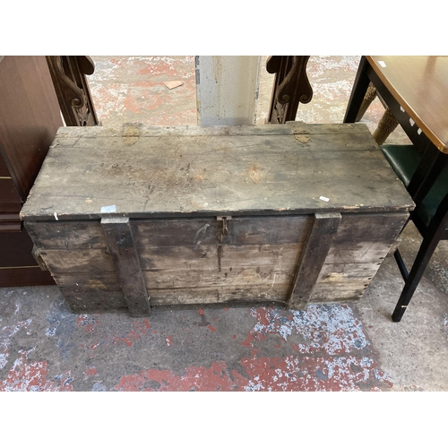 132 - An early 20th century pine tool box - approx. 54cm high x 109cm wide x 48cm deep