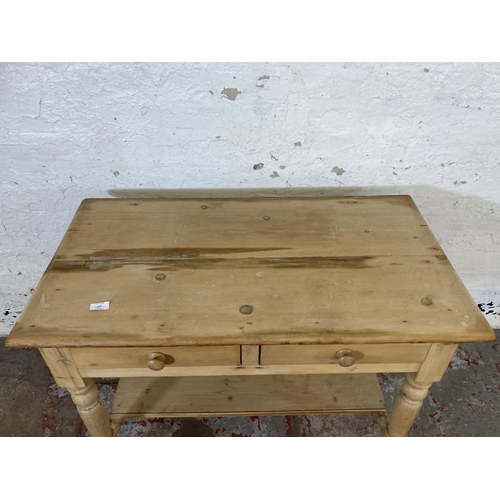 137 - A Victorian pine two drawer wash stand - approx. 73cm high x 95cm wide x 52cm deep