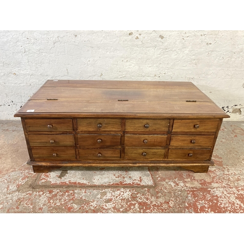 138 - An Indian hardwood twelve drawer coffee table - approx. 43cm high x 64cm wide x 118cm long
