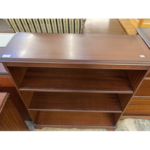 141 - A mahogany three tier open bookcase - approx. 96cm high x 87cm wide x 30cm deep