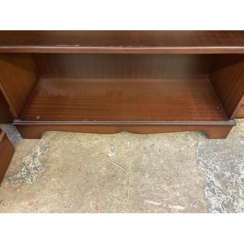 141 - A mahogany three tier open bookcase - approx. 96cm high x 87cm wide x 30cm deep