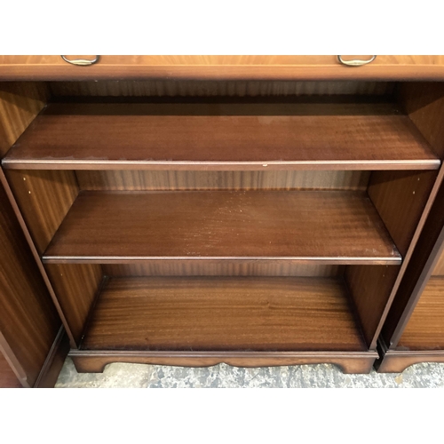 142 - A mahogany three tier open bookcase with single drawer - approx. 96cm high x 87cm wide x 30cm deep