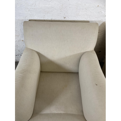 155 - A pair of Howard & Sons style fabric upholstered armchairs