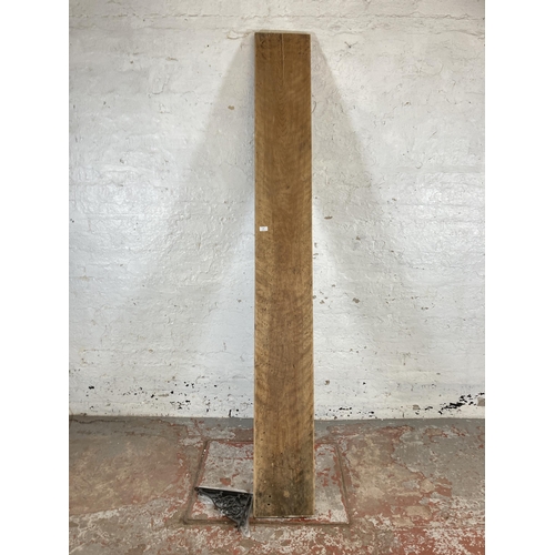157 - A rustic wooden shelf with cast metal brackets - approx. 227cm long x 27cm deep