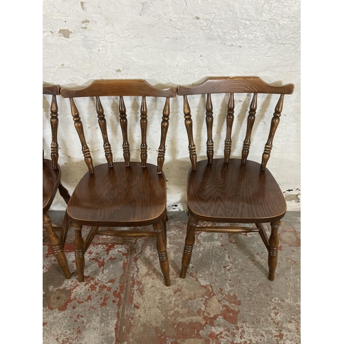 163 - Four elm and beech spindleback dining chairs