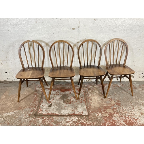 164 - Four mid 20th century Ercol elm and beech Windsor dining chairs