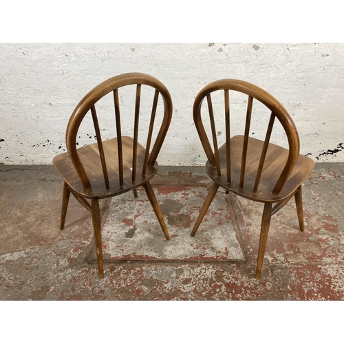 164 - Four mid 20th century Ercol elm and beech Windsor dining chairs