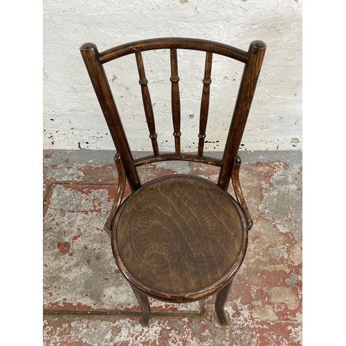 26 - Four early 20th century beech and bentwood occasional chairs, three Mundus and one Penny seat