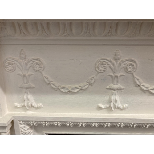 29 - A Victorian style white painted wooden fire surround - approx. 130cm high x 168cm wide x 20cm deep