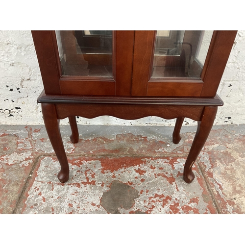 35 - A mahogany display cabinet with single glass shelf and cabriole supports - approx. 99cm high x 56cm ... 
