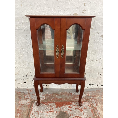 36 - A mahogany display cabinet with single glass shelf and cabriole supports - approx. 99cm high x 56cm ... 