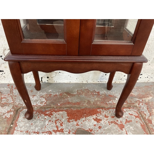 36 - A mahogany display cabinet with single glass shelf and cabriole supports - approx. 99cm high x 56cm ... 