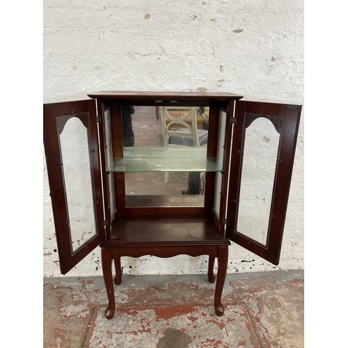36 - A mahogany display cabinet with single glass shelf and cabriole supports - approx. 99cm high x 56cm ... 