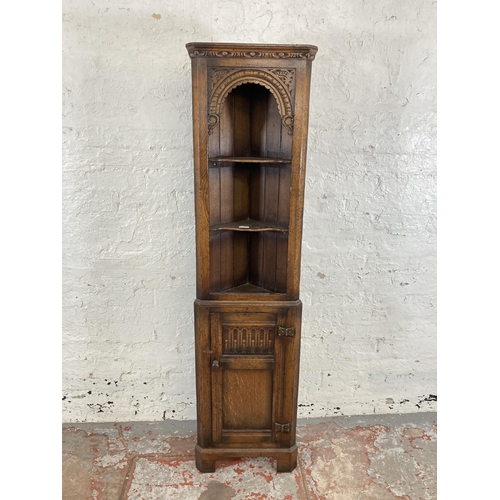 39 - A Titchmarsh & Goodwin style carved oak free standing corner cabinet - approx. 167cm high