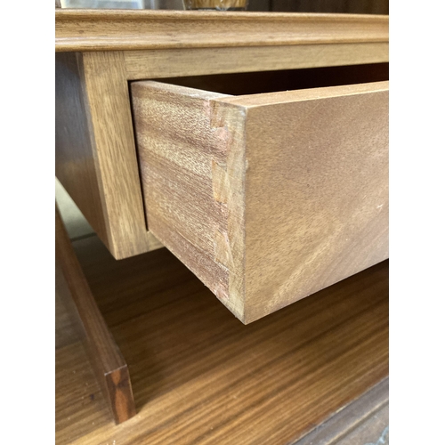 41 - A walnut cocktail cabinet on cabriole supports - approx. 98cm high x 89cm wide x 44cm deep