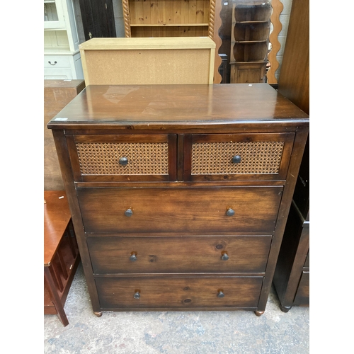 57 - A modern pine effect and rattan chest of drawers - approx. 105cm high x 88cm wide x 53cm deep