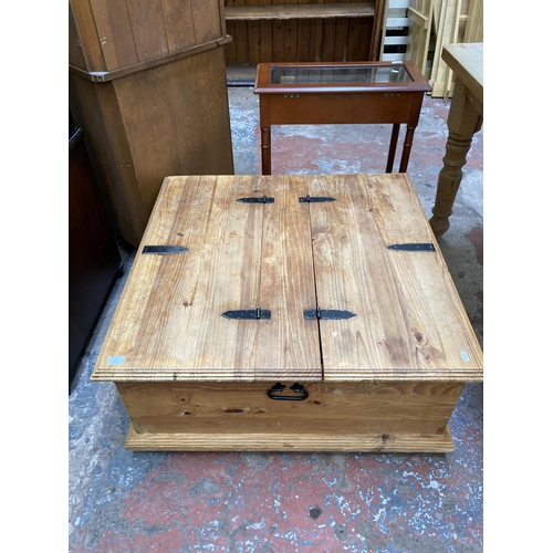 60 - A pine square storage coffee table - approx. 40cm high x 90cm square
