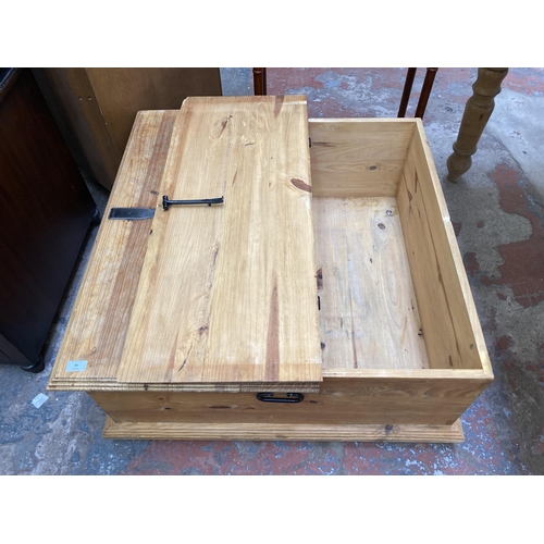 60 - A pine square storage coffee table - approx. 40cm high x 90cm square