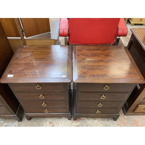 63 - A pair of Stag Minstrel mahogany bedside chests of drawers - approx. 72cm high x 52cm wide x 46cm de... 