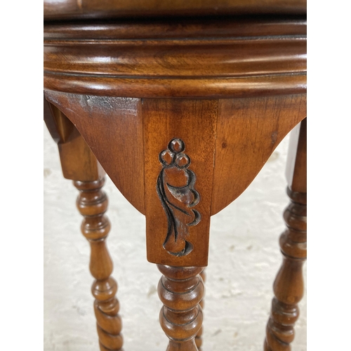 65 - A 19th century style mahogany barley twist two tier jardinière stand - approx. 102cm high x 27cm dia... 