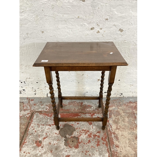 66 - An early 20th century oak barley twist side table - approx. 71cm high x 39cm wide x 56cm long