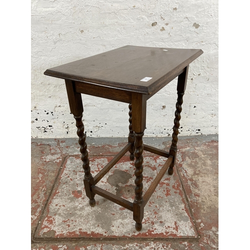 66 - An early 20th century oak barley twist side table - approx. 71cm high x 39cm wide x 56cm long