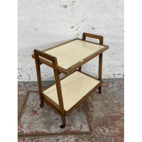 77 - A mid 20th century beech and white laminate two tier tea trolley