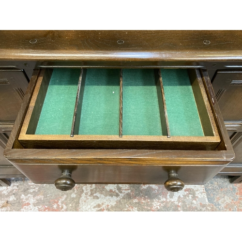 8 - A mid 20th century Ercol Old Colonial dark elm dresser - approx. 170cm high x 145cm wide x 50cm deep