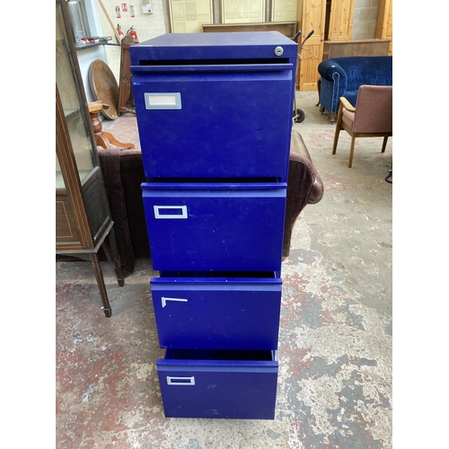 82 - A blue metal four drawer office filing cabinet - approx. 135cm high x 46cm wide x 62cm deep