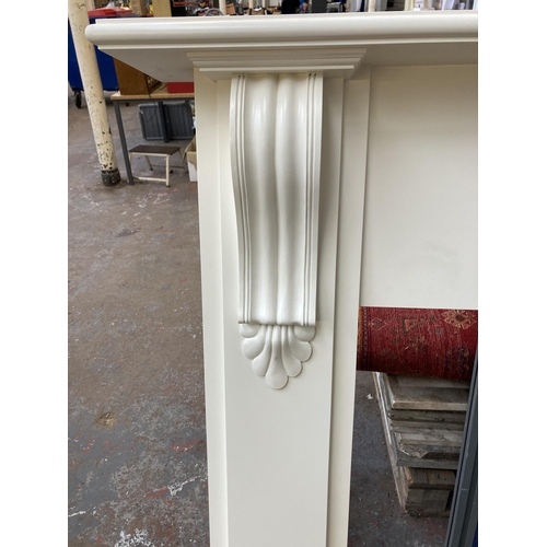 93 - A Victorian style white painted MDF fire surround - approx. 131cm high x 155cm wide x 23cm deep