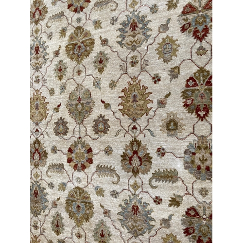 94 - A modern floral pattern rug - approx. 375cm x 270cm