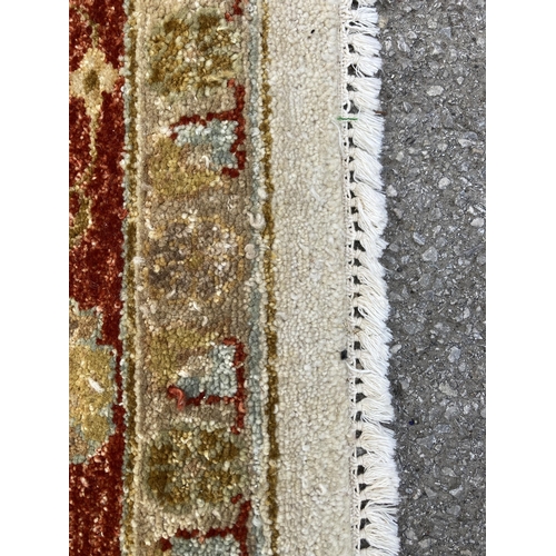 94 - A modern floral pattern rug - approx. 375cm x 270cm